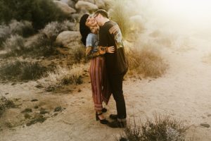tattooed couple during sunset in joshua tree national park