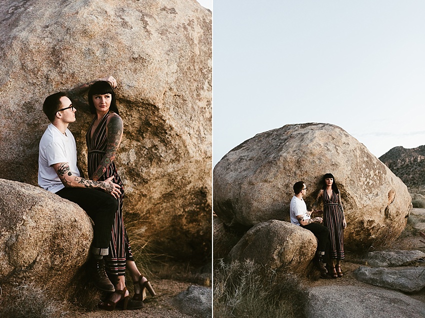 couple posing by rock in joshua tree national park
