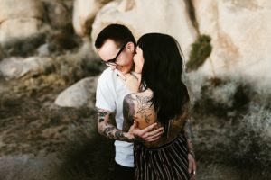 couple in joshua tree california with tattoos