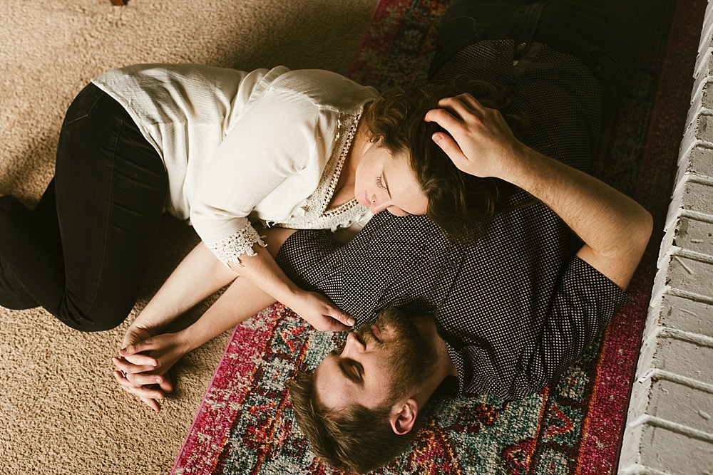 couple in home session laying on floor