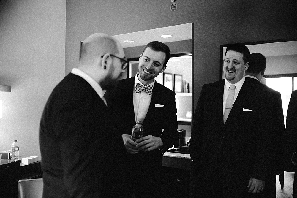 groomsmen-and-groom-laughing-metropolis-ballroom-wedding-chicago