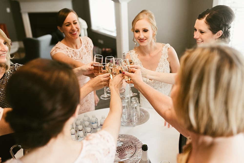 bride and bridesmaids toasting on her chicago metropolis ballroom wedding day