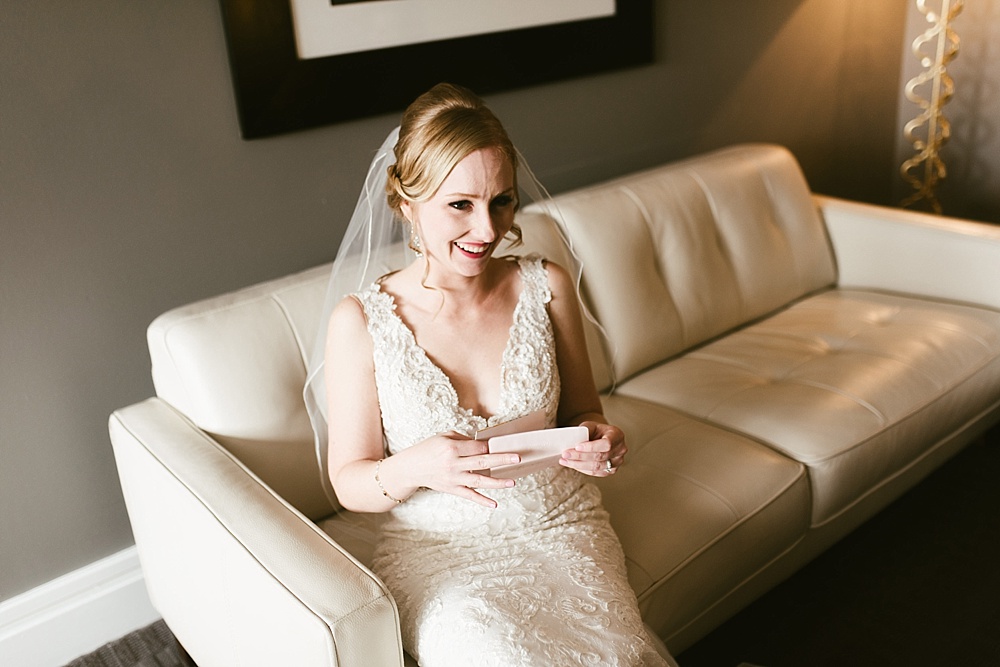 bride reading letter and crying on her metropolis ballroom wedding day