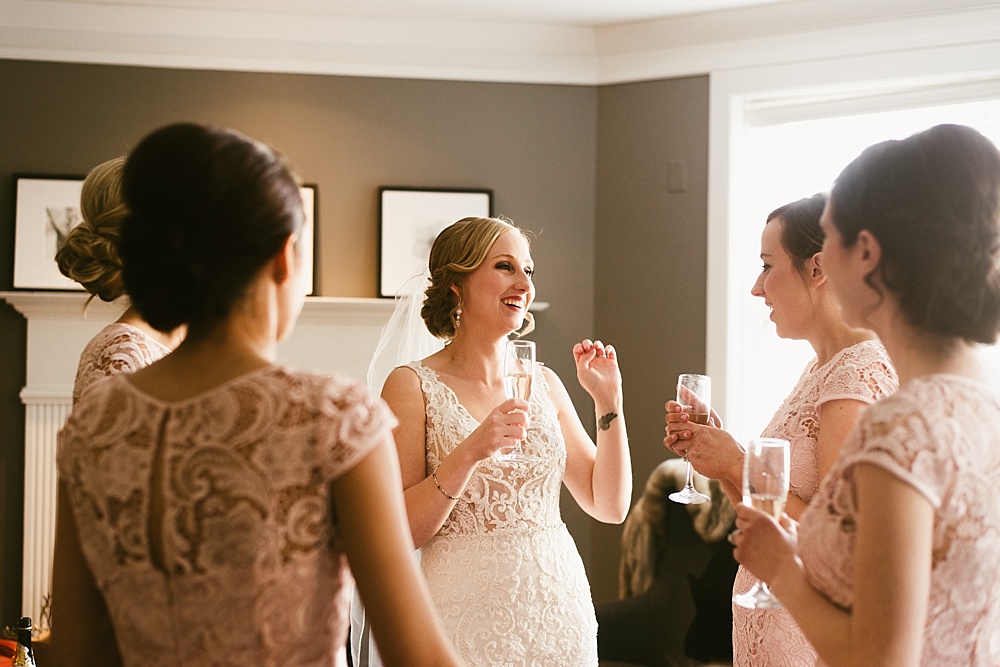 bride drinking champagne on her metropolis ballroom wedding day