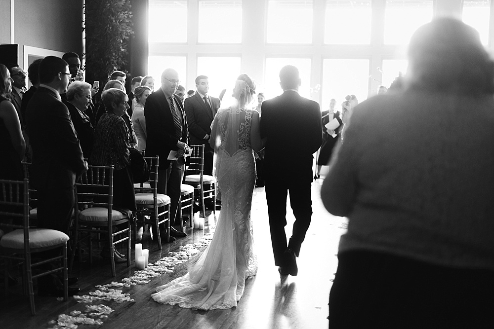 bride walking down aisle on her chicago wedding day at metropolis ballroom