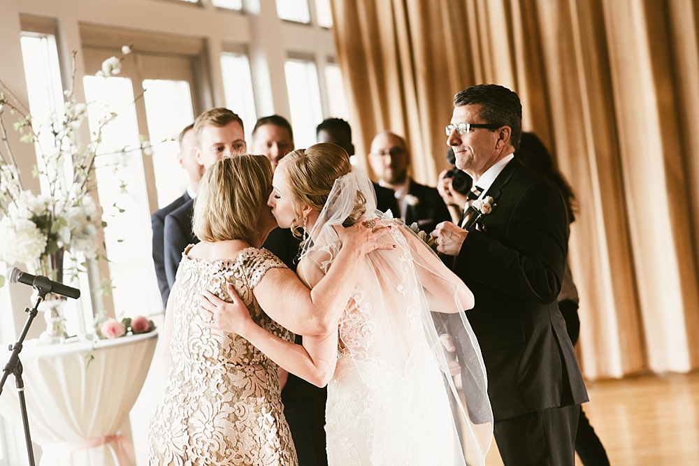 bride kissing mother on her metropolis ballroom chicago wedding day