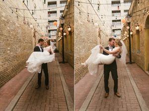 groom carrying bride in chicago alleyway