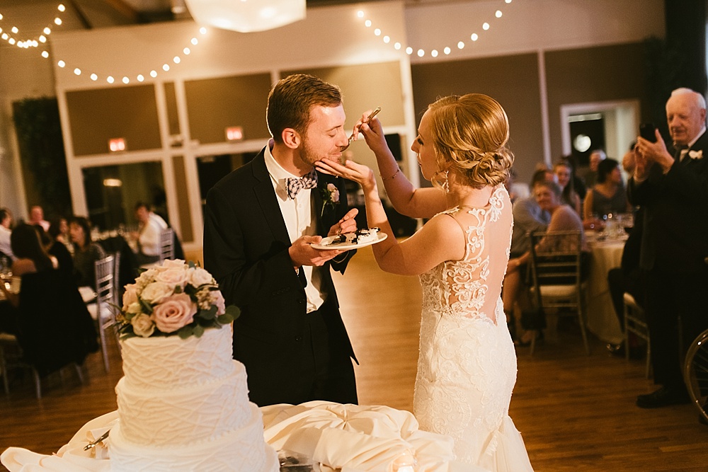 bride and groom feeding cake metropolis ballroom chicago