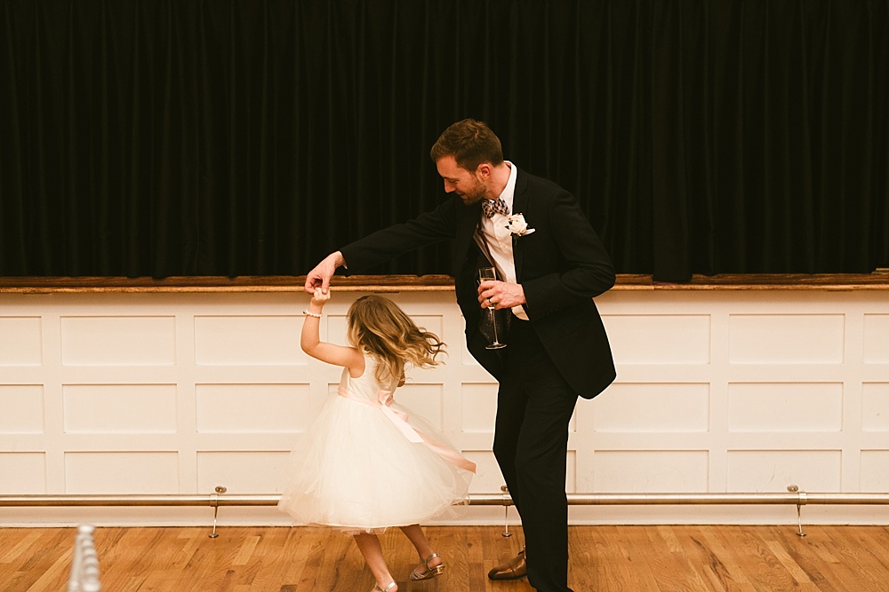 groom dancing with flower girl metropolis ballroom chicago wedding