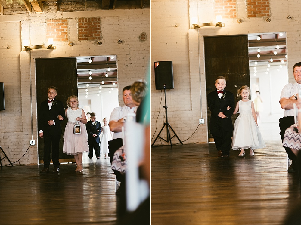 flower girls and ringbearers walking down aisle at coppes commons indiana