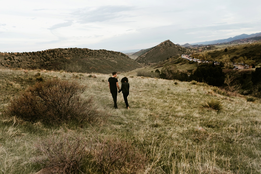 couple walking through mountains morrison colorado