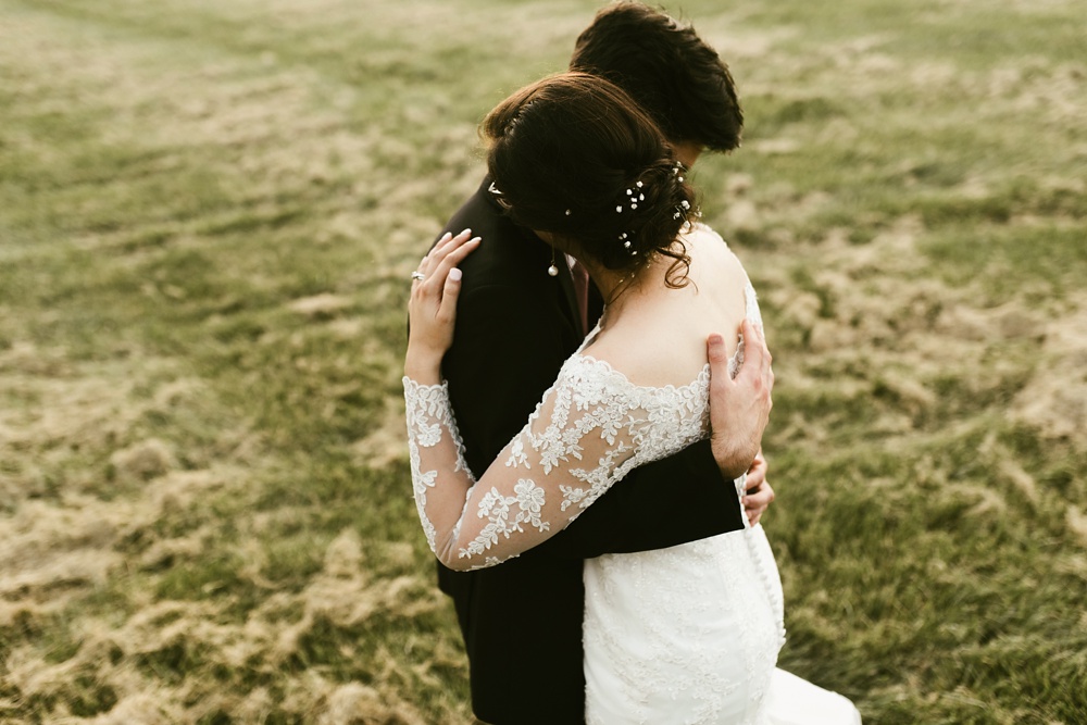 bride and groom embracing at goegleins homestead