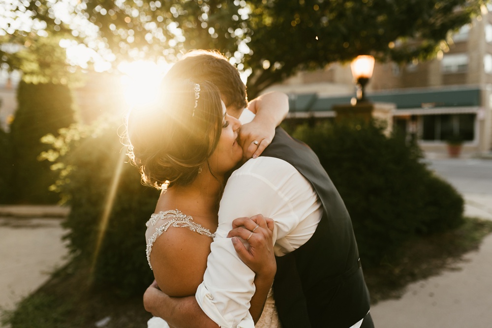bride and groom hugging at sunset downtown fort wayne