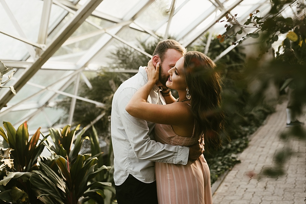 couple hugging in botanical gardens fort wayne