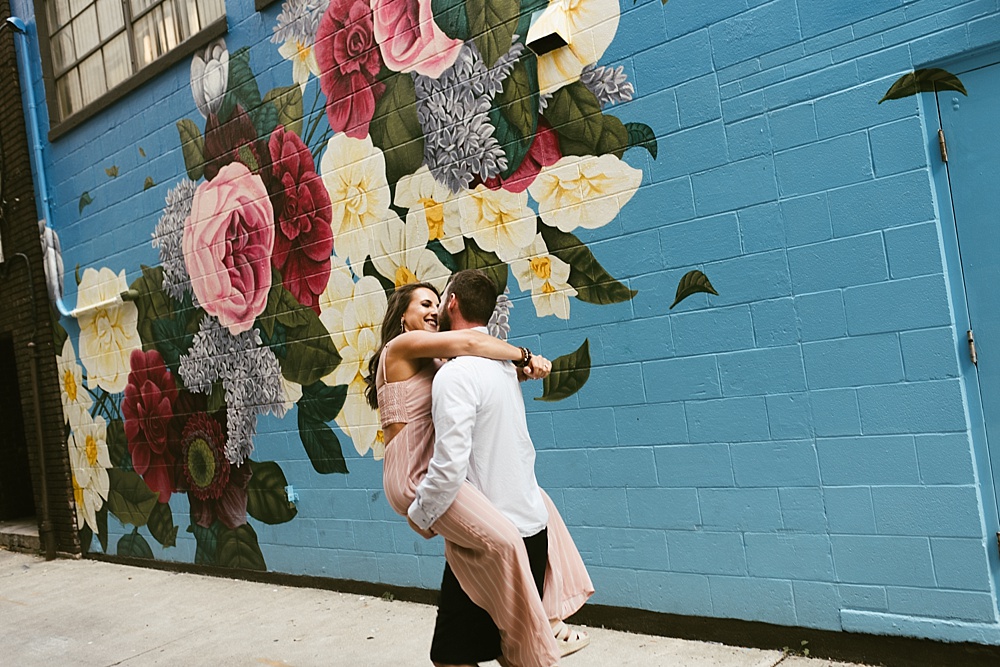 couple in front of fort wayne mural