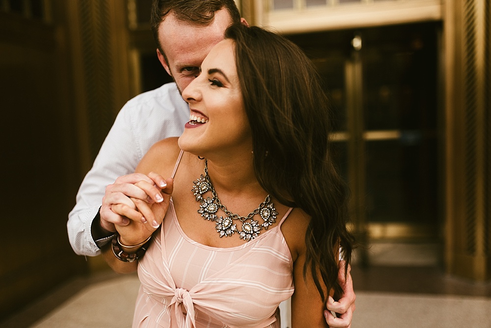guy kissing girl downtown fort wayne engagement session