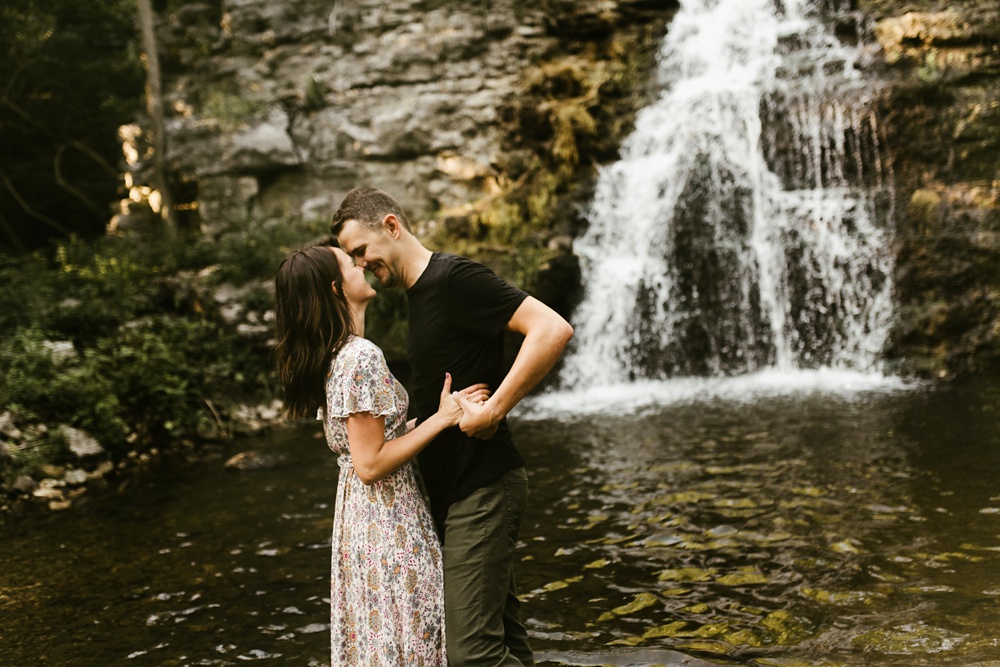 engaged couple in front of france park waterfall