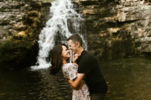engaged couple in front of france park waterfall