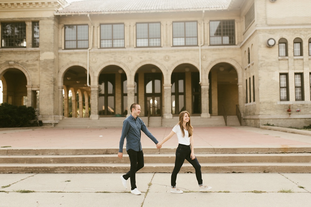 couple walking by casino at belle isle detroit engagement session