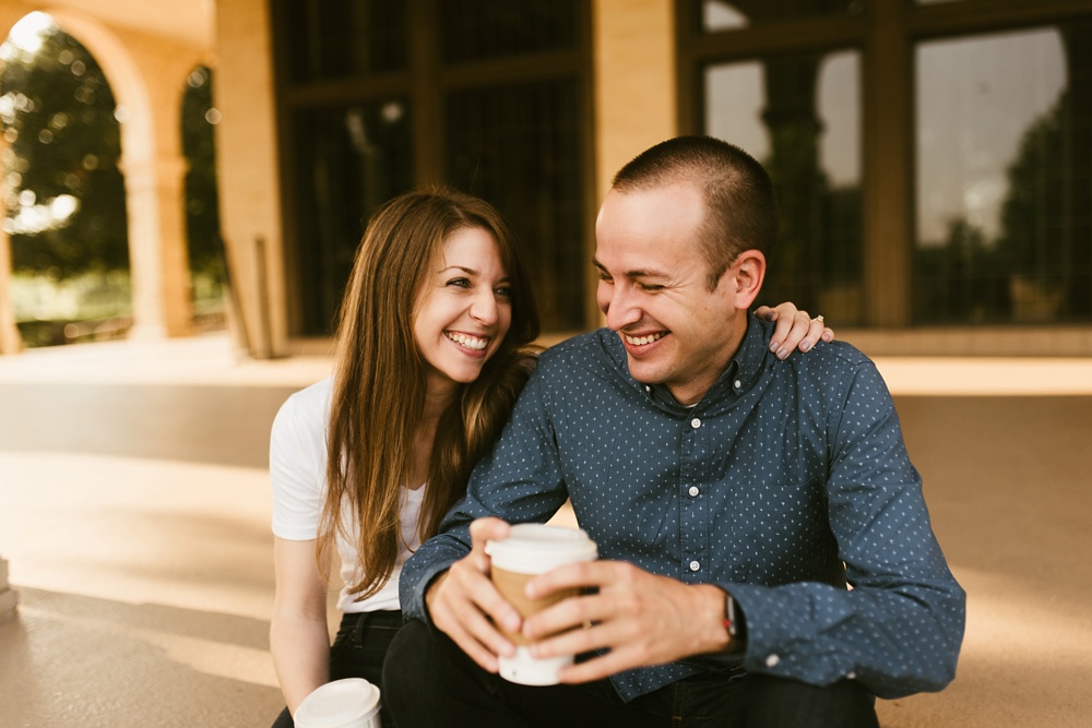 couple with coffee at belle isle detroit engagement session