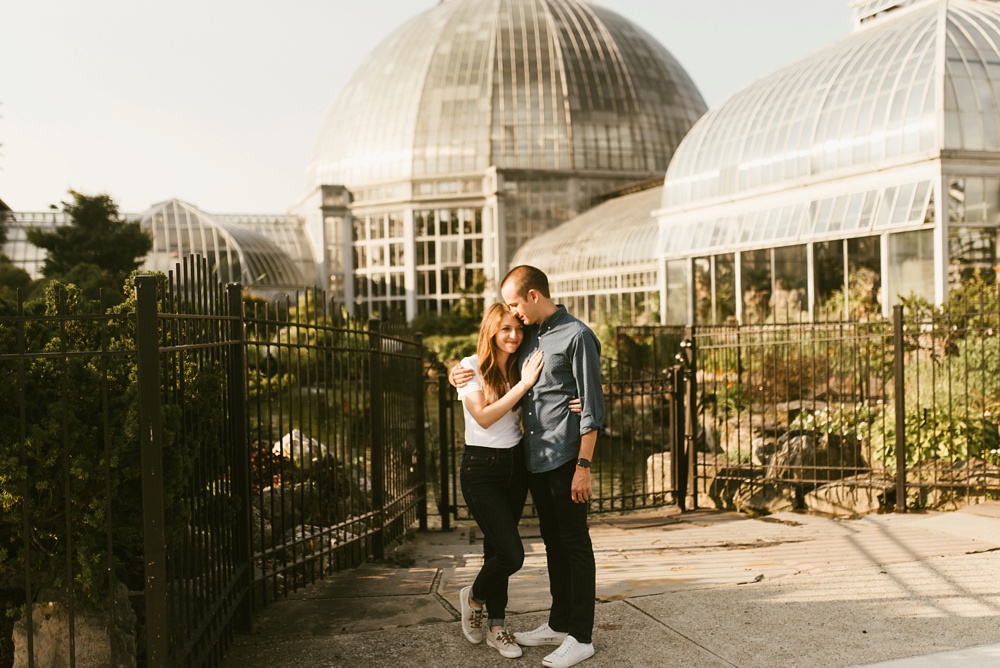 couple standing in front of conservatory at belle isle detr