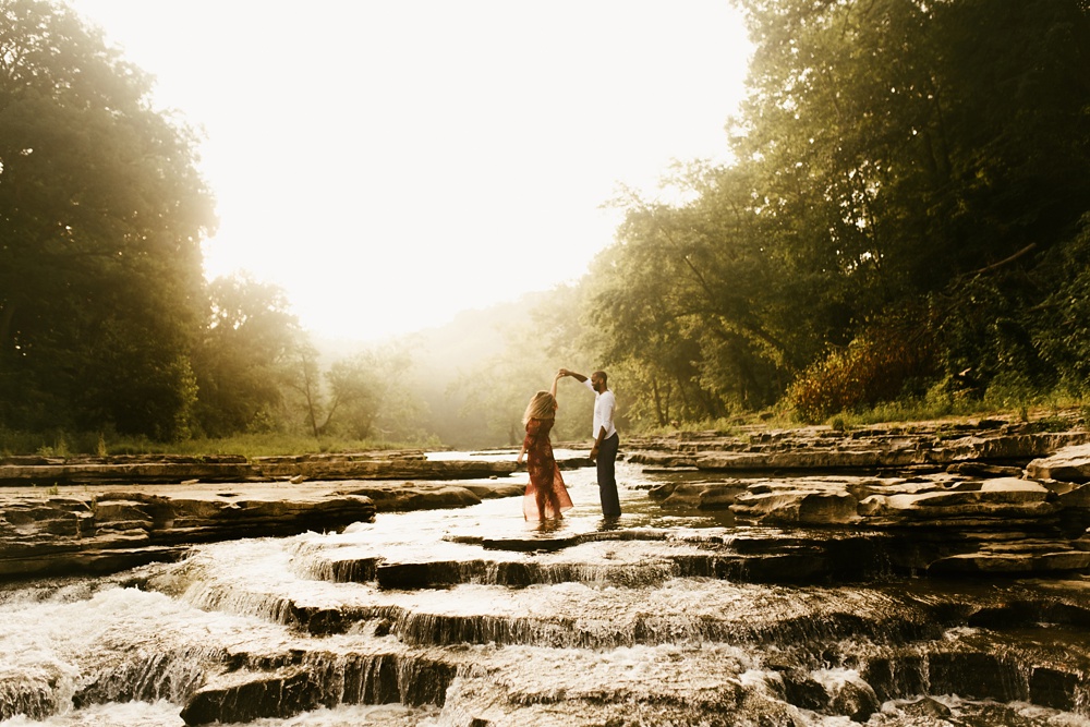 couple dancing during engagement session at cataract falls