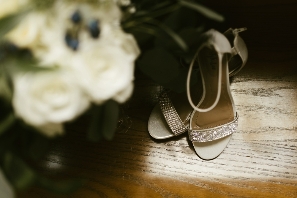 wedding shoes and flowers at st. anthony's catholic church