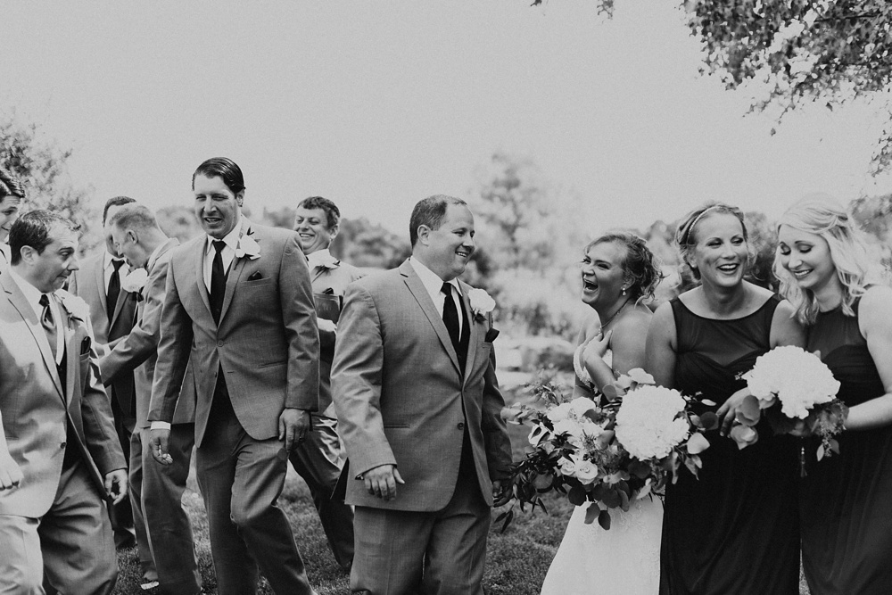 bridal party laughing with couple at glendarin golf course