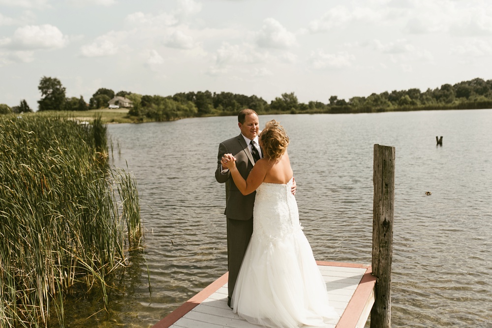 wedding couple dancing by lake at glendarin golf course