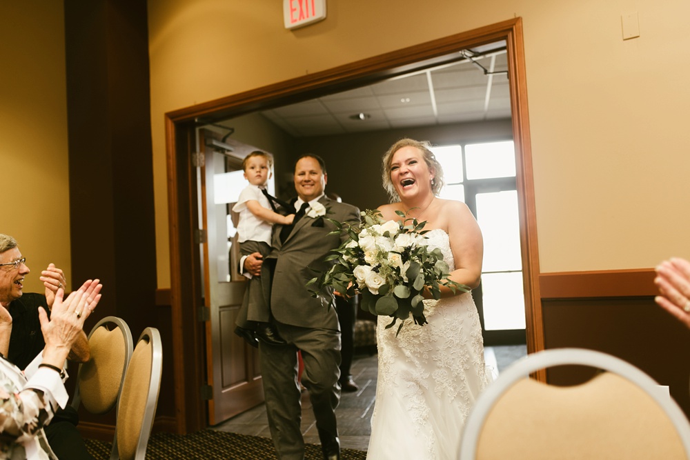 bride and groom entering ceremony at glendarin golf course