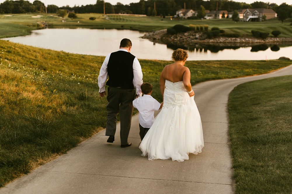 bride, groom and son at glendarin golf course
