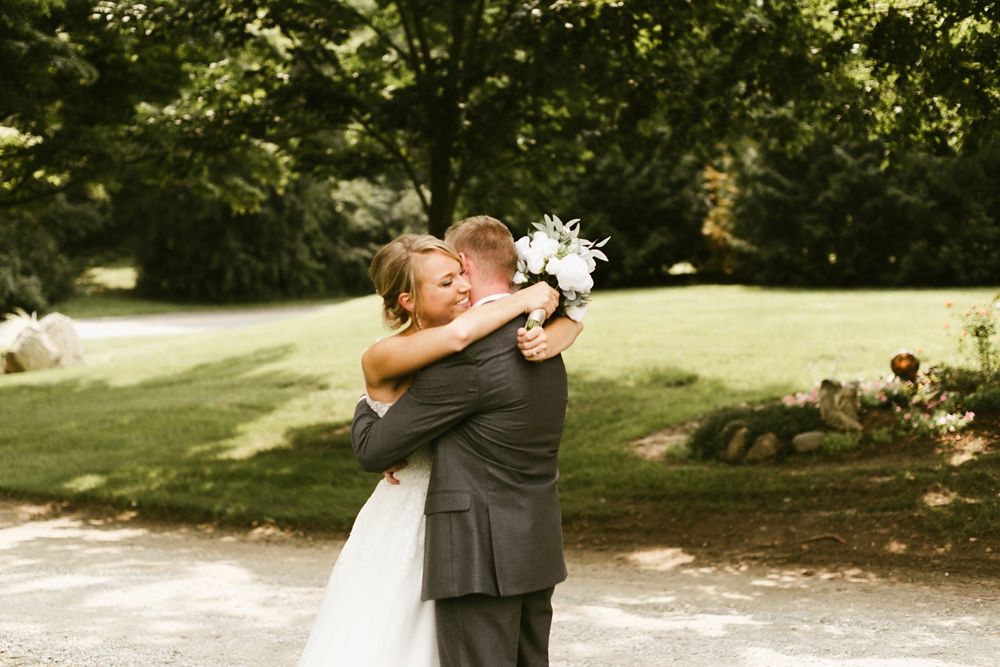bride and groom hugging at first look ceremony at j weaver barn wedding
