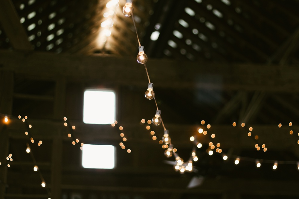 market lights in barn at j weaver barn wedding