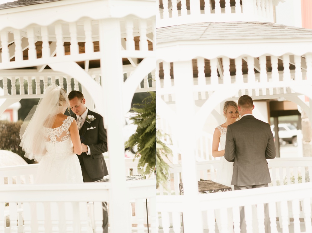 bride and groom exchanging rings under gazebo at j weaver barn wedding
