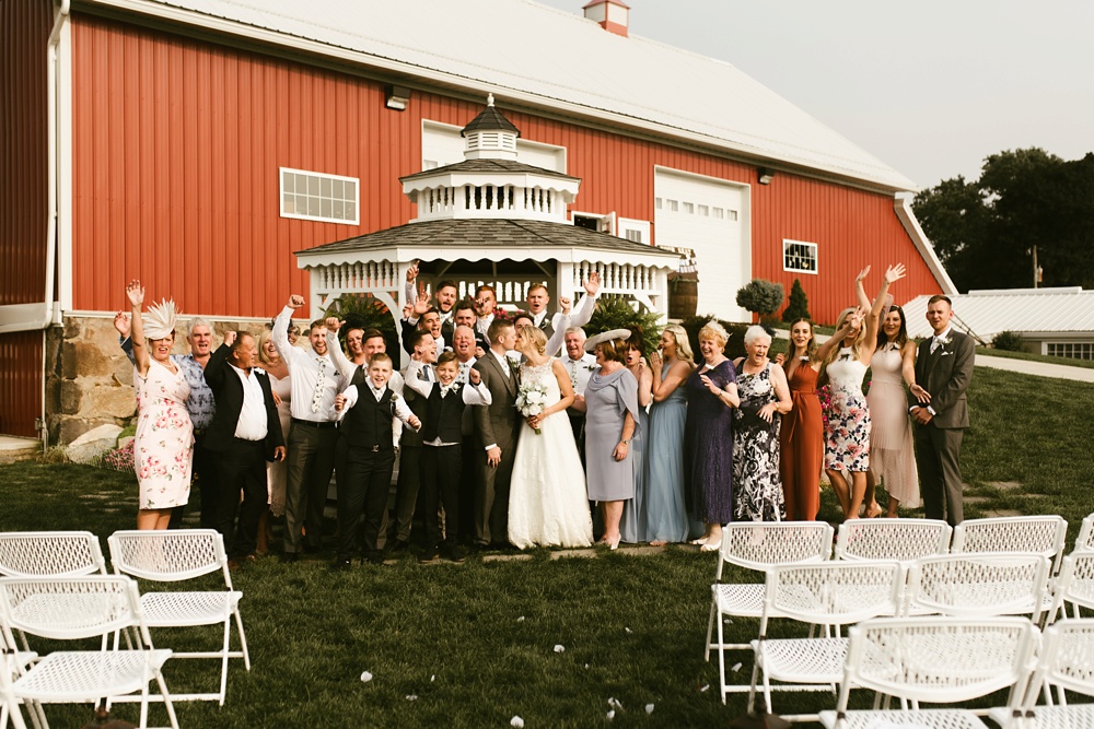 bride, groom and family at j weaver barn wedding