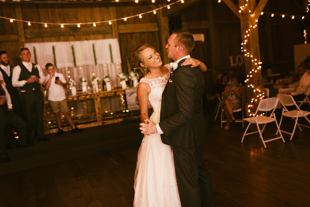 bride and groom laughing during first dance at j weaver barn wedding