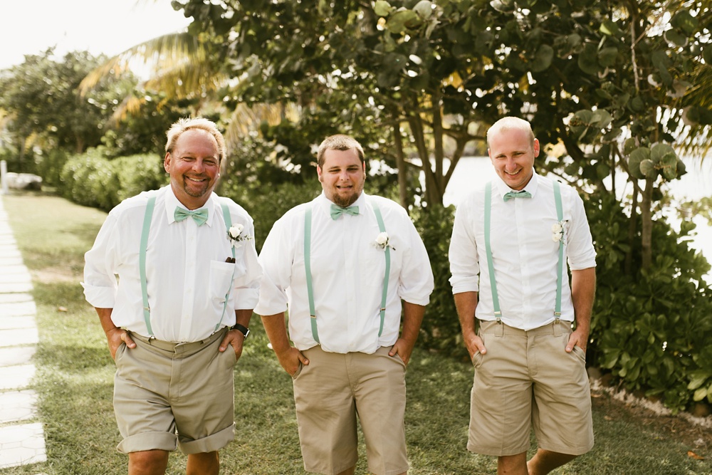 groomsmen in khaki shorts, suspenders and bowties at grand palladium jamaica wedding