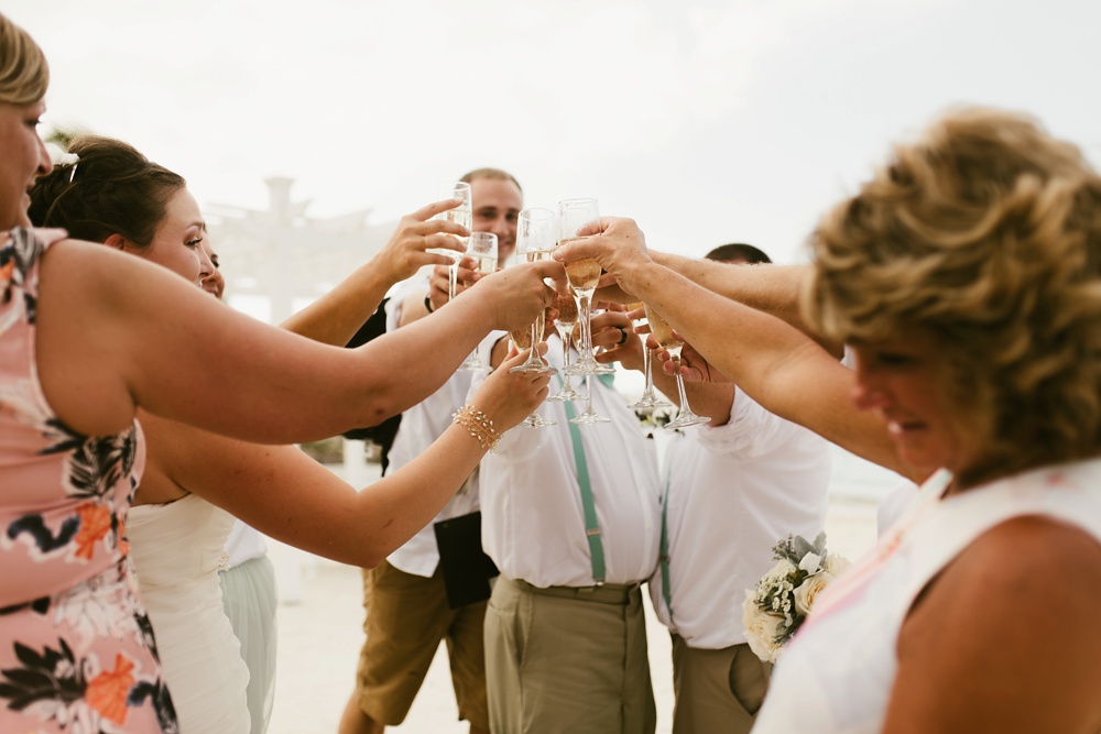 wedding guests and bridal party with champagne at grand palladium jamaica wedding