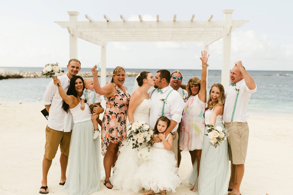 wedding party and family at oceanside ceremony at grand palladium jamaica wedding