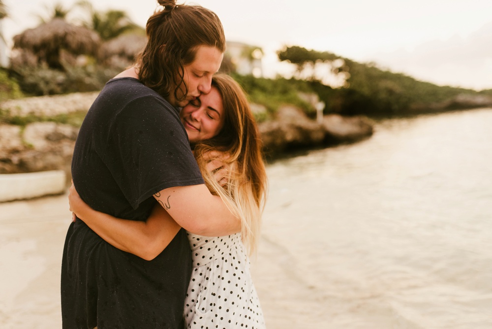 couple hugging on beach grand palladium jamaica