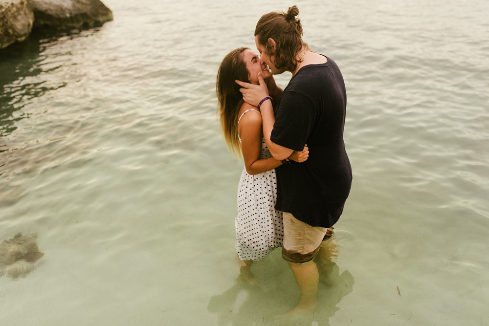 couple kissing in ocean at grand palladium jamaica