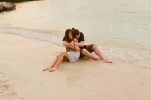 couple hugging oceanside on grand palladium beach jamaica