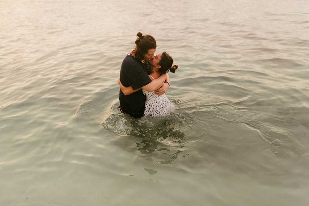 couple kissing in ocean water at grand palladium jamaica