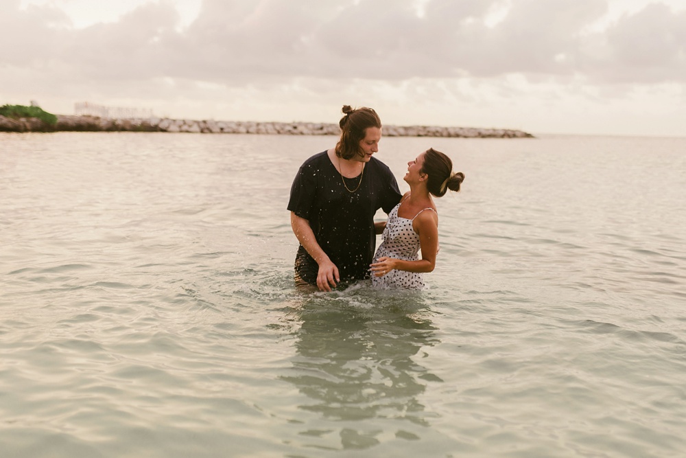 couple laughing in ocean water at grand palladium jamaica