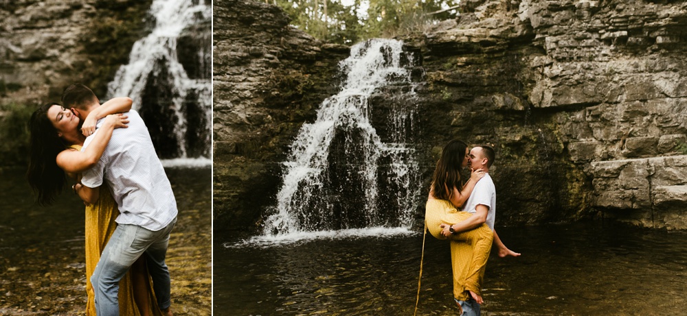couple hugging in water at indiana waterfall engagement photoshoot