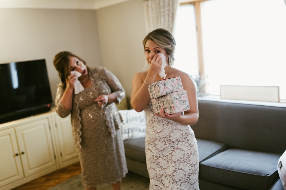bride and mother of bride crying together at pine valley country club wedding