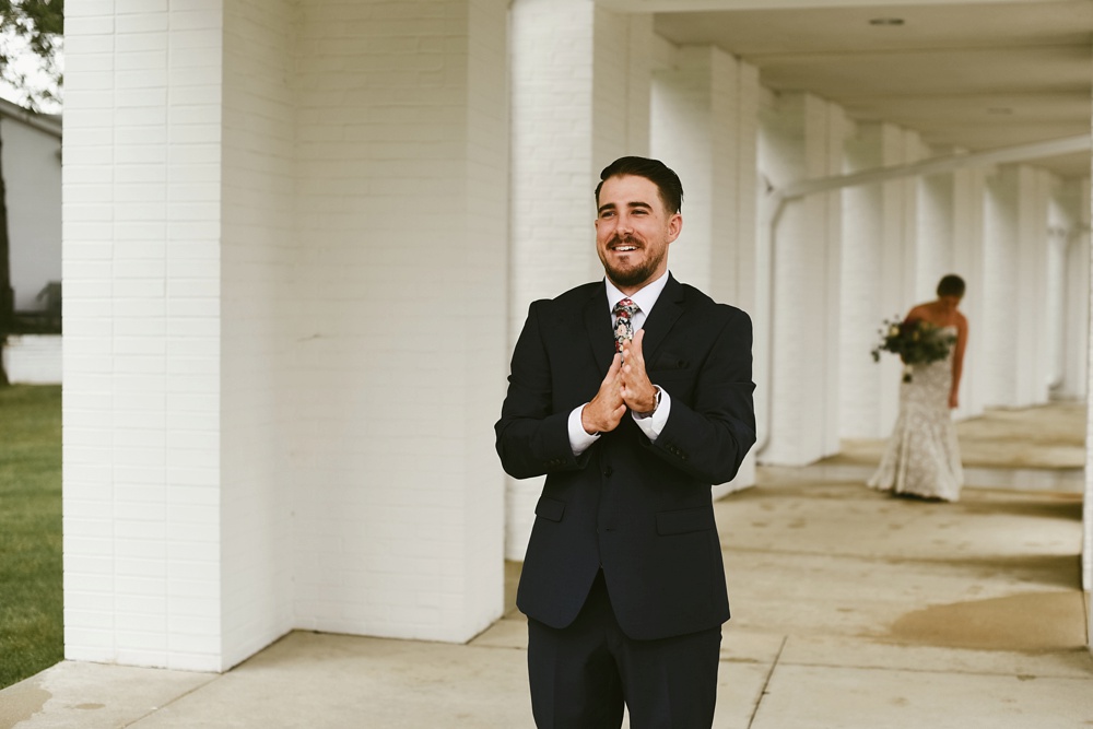 groom waiting for first look at pine valley country club wedding