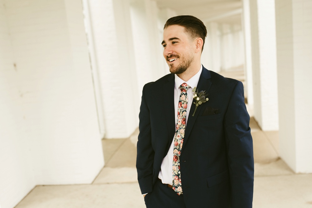 groom laughing at pine valley country club wedding