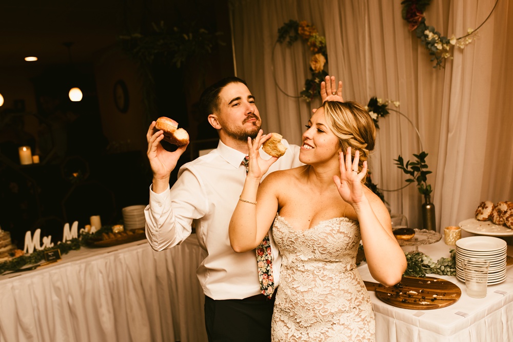 bride and groom dancing with doughnuts at pine valley country club wedding