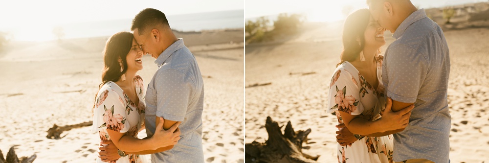 couple laughing at dune at warren dunes state park engagement session